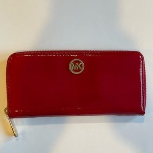Michael Kors red patent zippy wallet